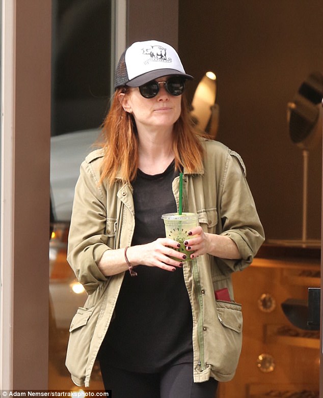 Incognito: The accredited actress, 56, hid under a baseball cap and sunglasses while taking a stroll near her apartment in the West Village