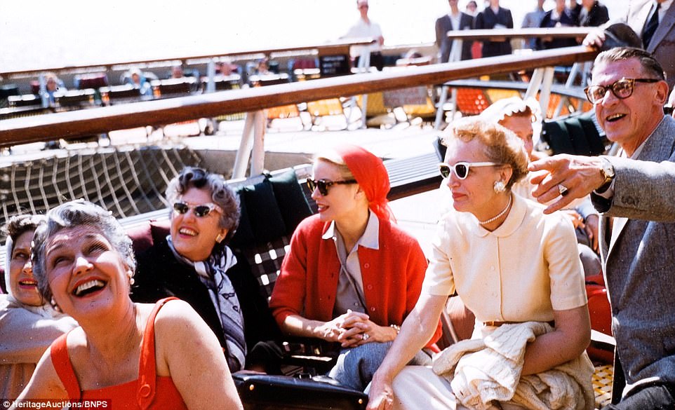 Kelly, pictured in red, took the eight-day boat trip to Monaco with her family and bridesmaids ahead of the wedding. Kelly is pictured above center in red, with her mother, Margaret Kelly (in creme with white sunglasses), and her godmother, Pauline McCloskey (third from left in black)
