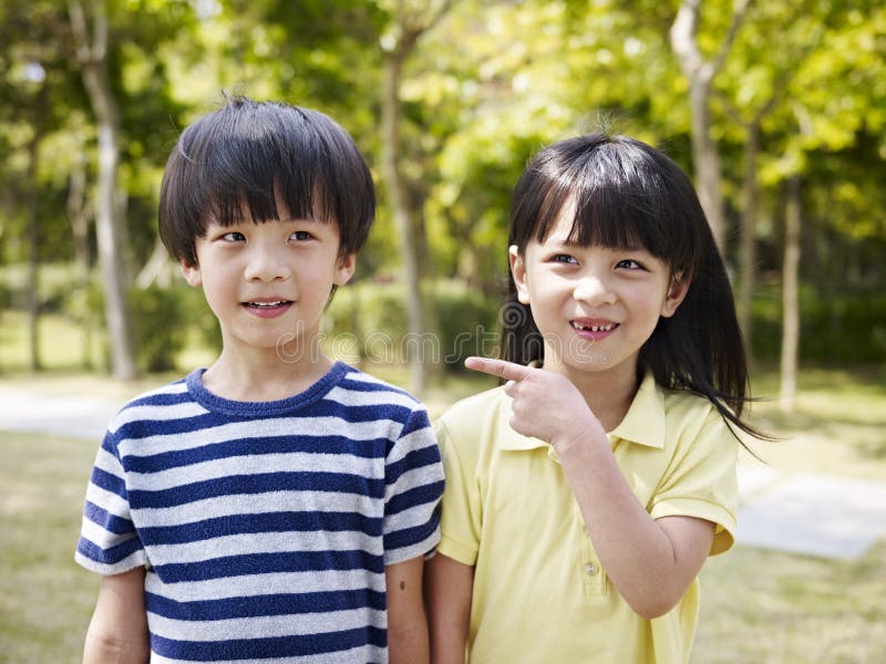 Asian brother and sister. Looking cute and funny royalty free stock image