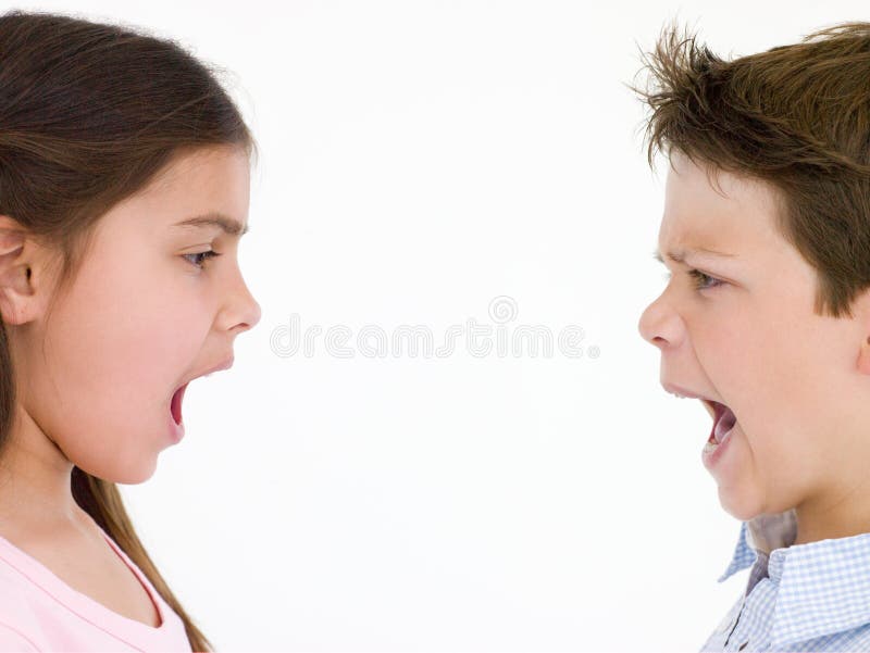 Brother and sister looking at each other shouting.  royalty free stock photos