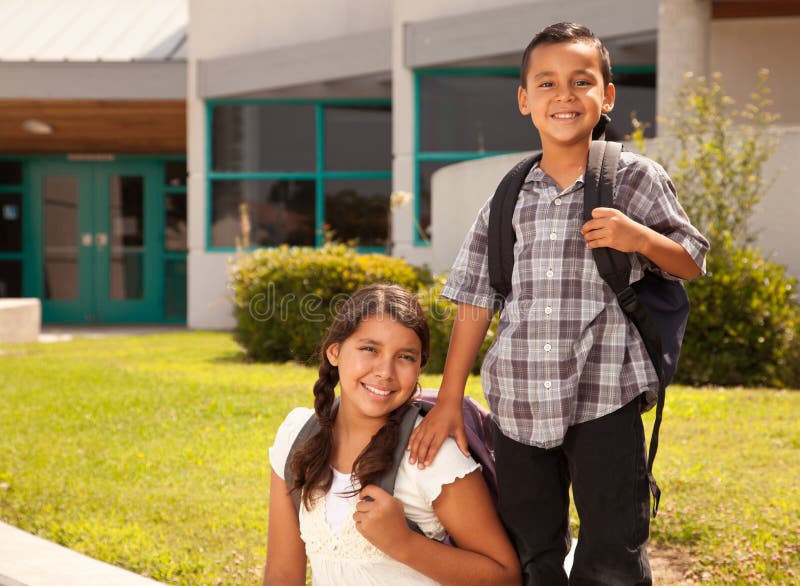 Cute Hispanic Brother and Sister Ready for School. Cute Hispanic Brother and Sister Wearing Backpacks Ready for School royalty free stock photo