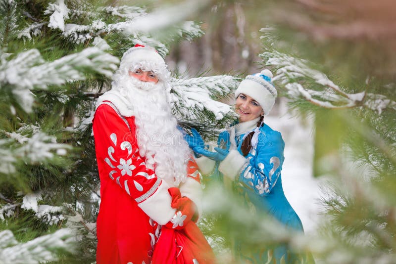 Ded Moroz (Father Frost) and Snegurochka (Snow Maiden) with gifts bag. Russian Christmas characters: Ded Moroz (Father Frost) and Snegurochka (Snow Maiden) with royalty free stock photos