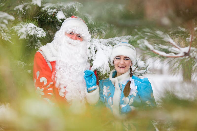 Ded Moroz (Father Frost) and Snegurochka (Snow Maiden) with gifts bag. Russian Christmas characters: Ded Moroz (Father Frost) and Snegurochka (Snow Maiden) with royalty free stock image