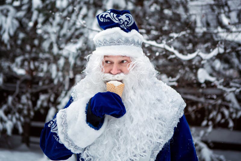 Father Frost is eating ice cream. Funny shot. Winter. Russian Christmas character Ded Moroz. Father Frost is eating ice cream. Funny shot. Winter, December royalty free stock photos