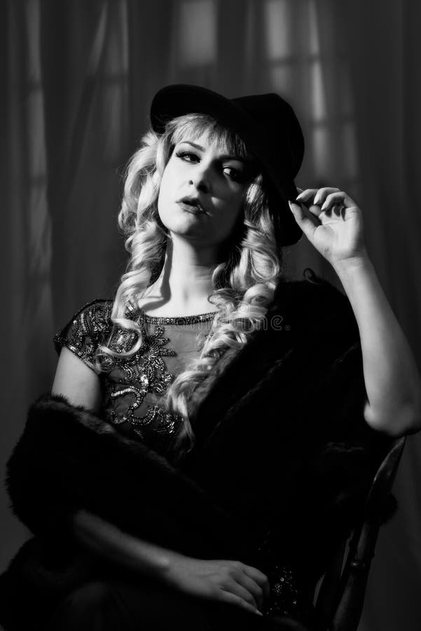 Film Noir Woman. Film Noir style woman wearing a trilby hat stock images