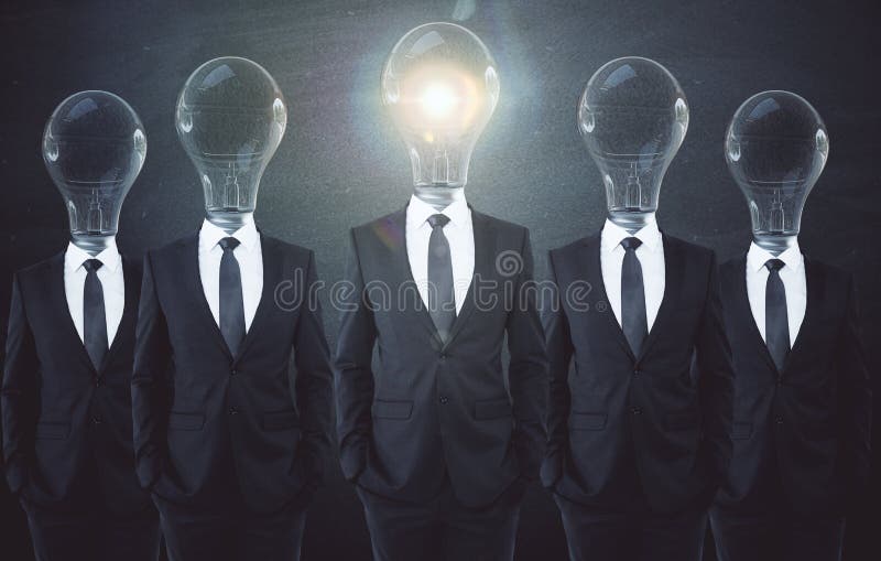 Imagination concept. Glowing lamp headed businessmen on chalkboard background. Imagination concept stock photography