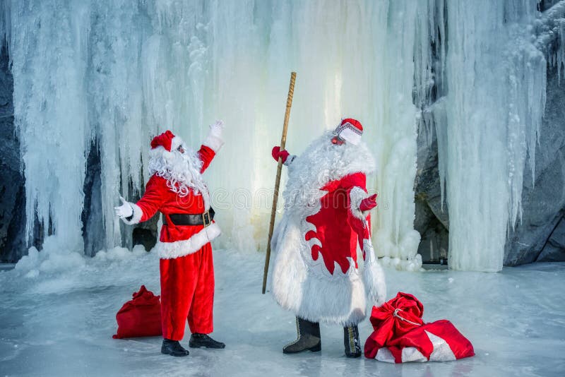 Santa Claus and Ded Moroz meeting. Santa Claus and Ded Moroz cheerful meeting stock image