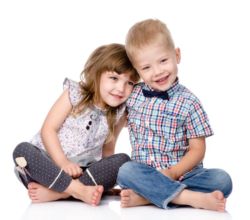 Smiling brother and little sister hugging. isolated. On white royalty free stock image