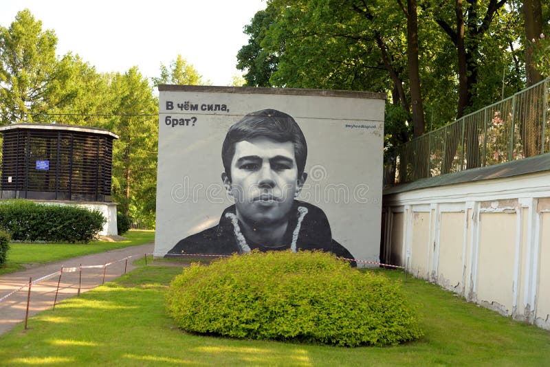 Graffiti in center of St.Petersburg. ST.PETERSBURG, RUSSIA - 3 JULY 2017: Building with graffiti. On the graffiti depicted Sergei Bodrov,, soviet and russian stock images