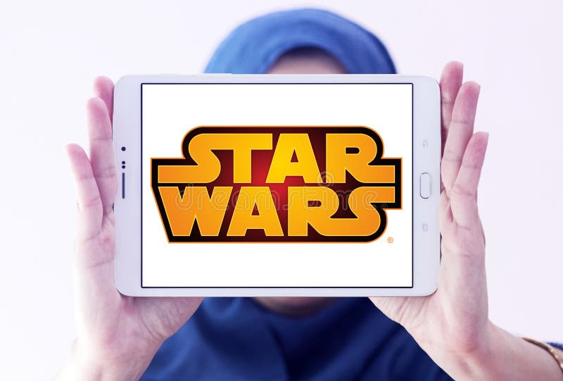 Star Wars logo. Logo of Star Wars on samsung tablet holded by arab muslim woman. Star Wars is an American epic space opera media franchise, centered on a film royalty free stock photography