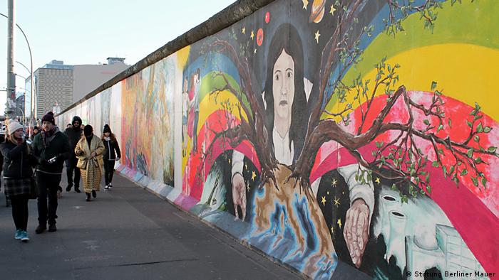 Part of the East Side Gallery with bright paintings on the Berlin Wall (Stiftung Berliner Mauer)