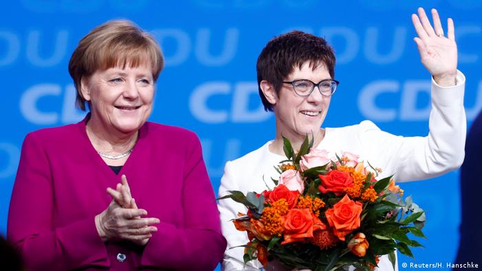 Annegret Kramp-Karrenbauer is congratulated by Angela Merkel (Reuters/H. Hanschke)