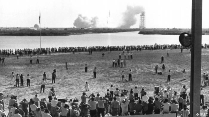 Thousands of news reporters watch Apollo 11 launch.