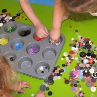 using button for sensory play