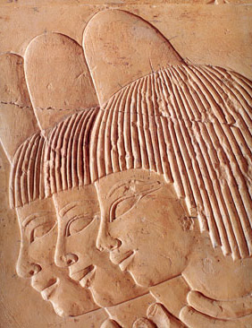 More often than not, common women are depicted wearing perfume cones on their heads, which slowly released perfumed fats into their hair, as in this relief from the tomb of Khaemhat on the West Bank at Luxor